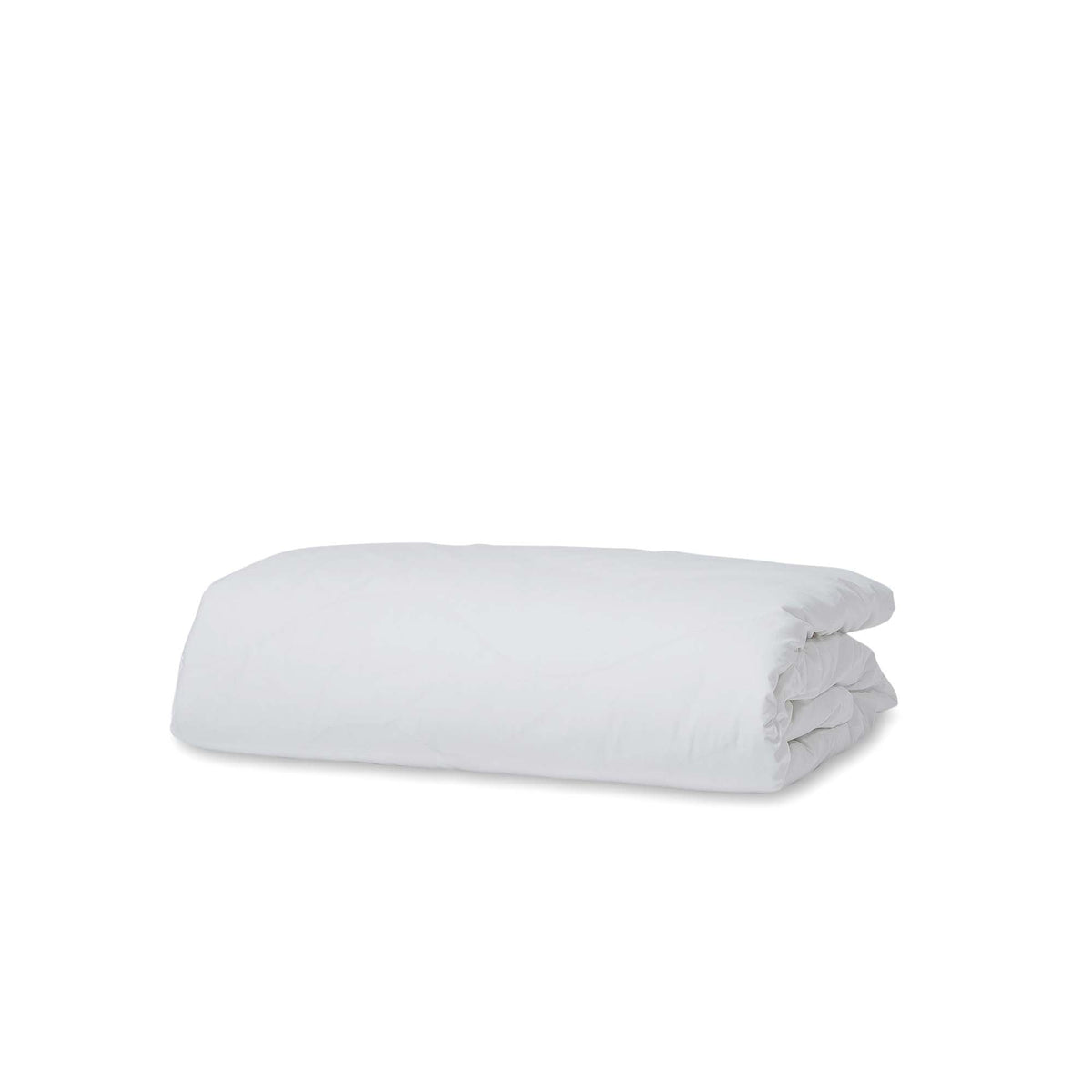 White cotton bed linen styled for a cool and comfortable summer bedroom