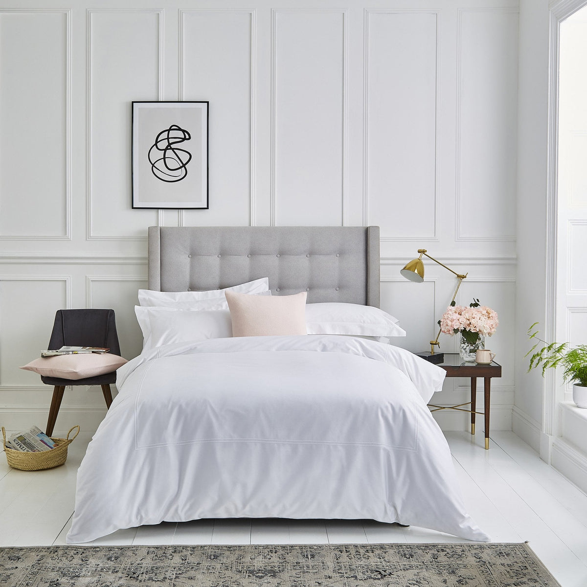 White Lexington cotton sateen bed linen styled on a luxury hotel-inspired bed