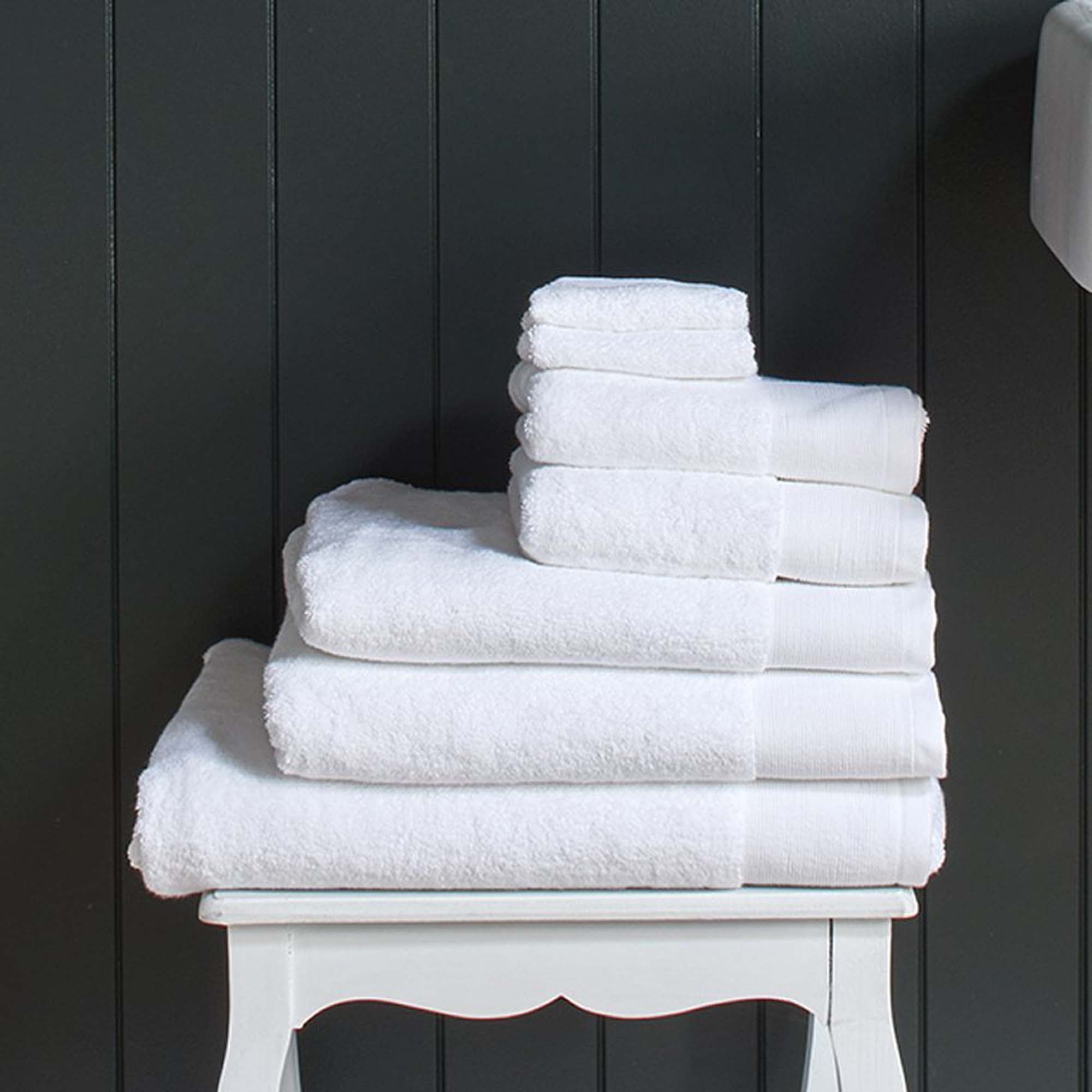 Stack of plush white Como organic cotton towels